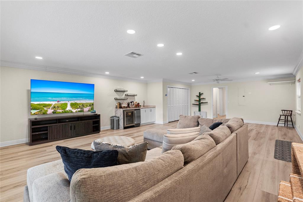 11391 Sundance Lane Boca Raton, FL 33428 - Photo 32 of 58 a living room with furniture kitchen and a large window