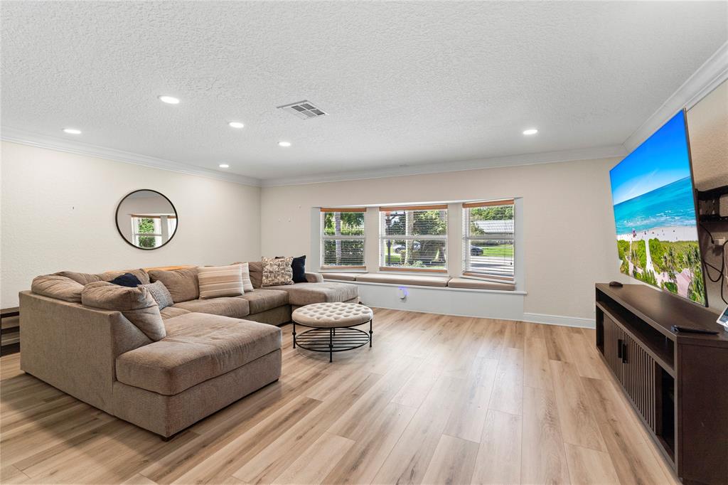 11391 Sundance Lane Boca Raton, FL 33428 - Photo 34 of 58 a living room with furniture and a flat screen tv