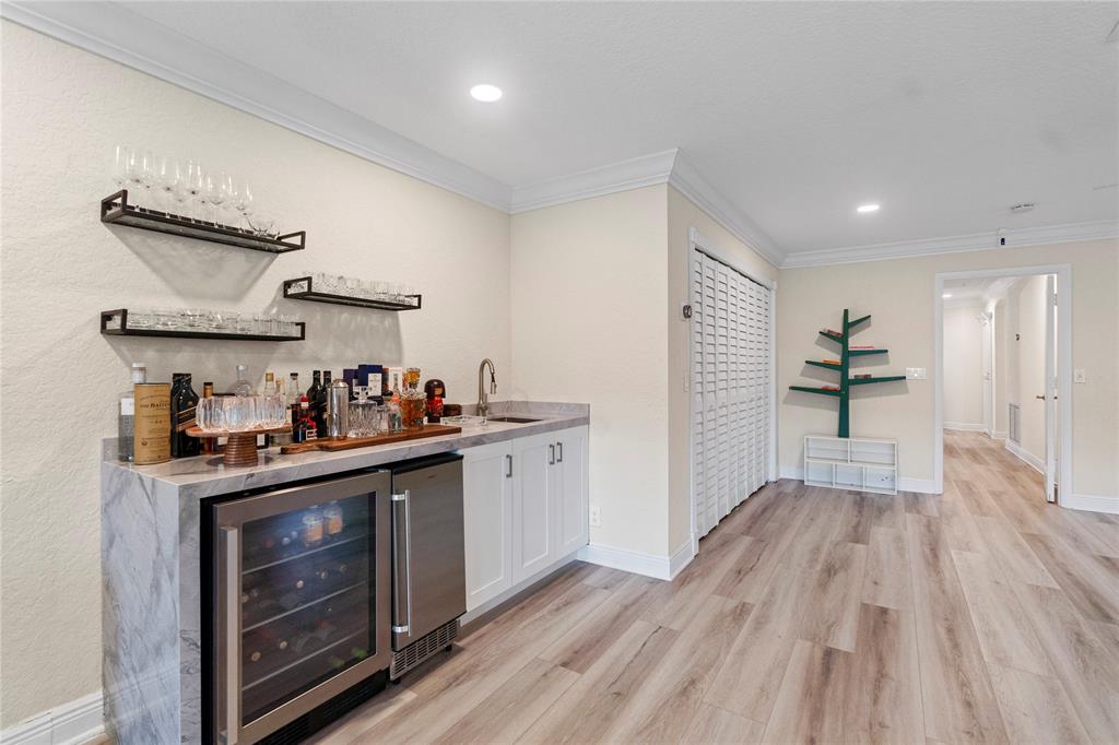 11391 Sundance Lane Boca Raton, FL 33428 - Photo 35 of 58 a kitchen with a sink and wooden floor