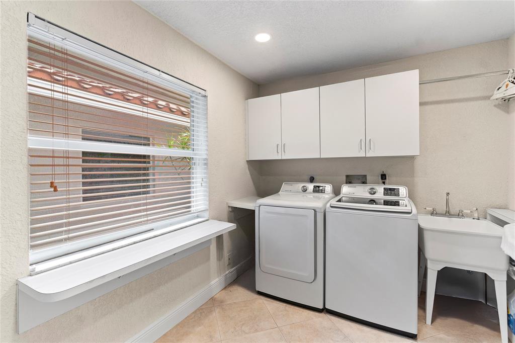 11391 Sundance Lane Boca Raton, FL 33428 - Photo 43 of 58 a utility room with dryer and washer