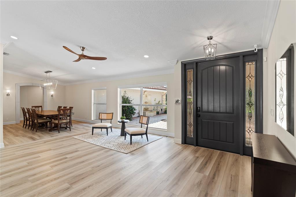 11391 Sundance Lane Boca Raton, FL 33428 - Photo 7 of 58 a living room with furniture and a wooden floor