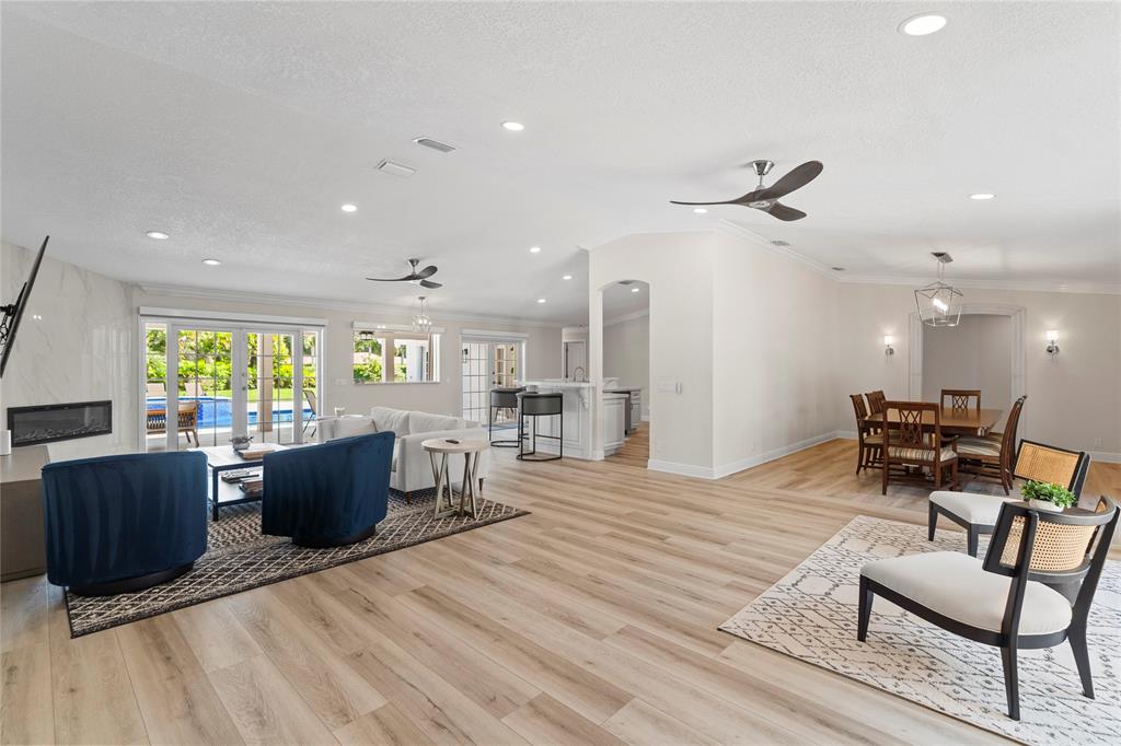 11391 Sundance Lane Boca Raton, FL 33428 - Photo 8 of 58 a living room with furniture a floor to ceiling window and wooden floor