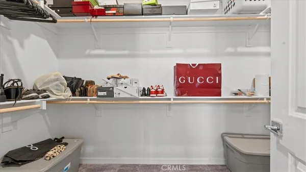 a utility room with sink cabinets and appliances