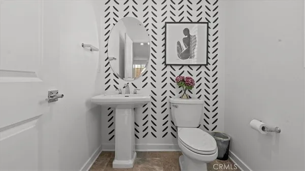 a bathroom with a toilet and a sink