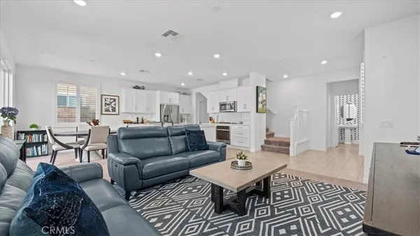 a living room with furniture and a table