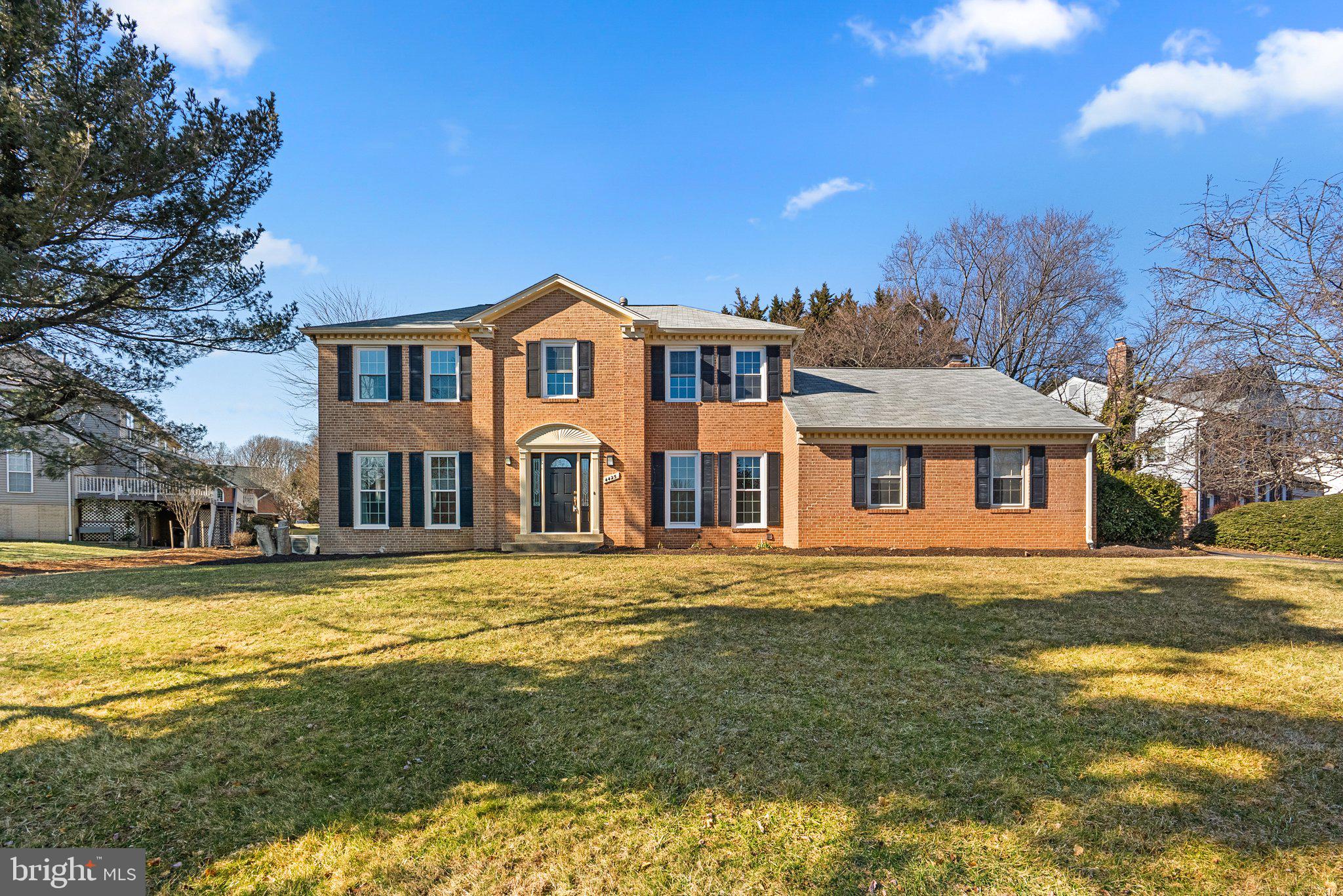 4425 Thornhurst Drive Olney, MD 20832 - Photo 1 of 60 a front view of a house with a garden