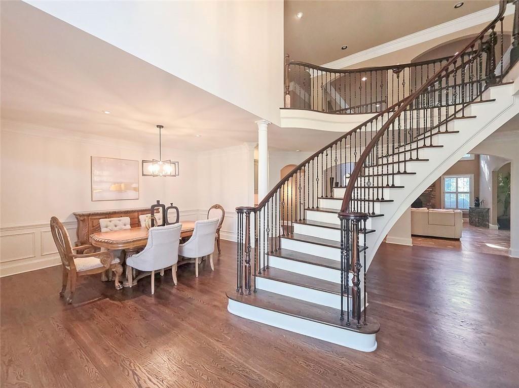 2502 Oak Hill Overlook Duluth, GA 30097 - Photo 11 of 34 a view of dining room and hall with wooden floor