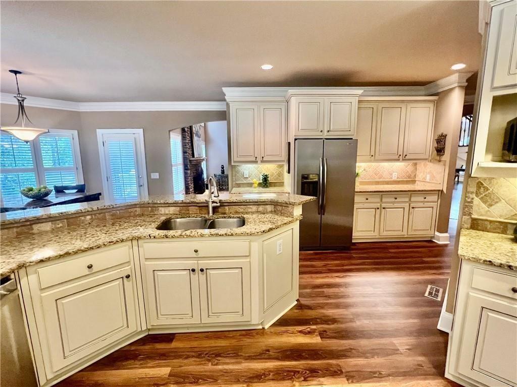 2502 Oak Hill Overlook Duluth, GA 30097 - Photo 16 of 34 a kitchen with a sink stove and refrigerator