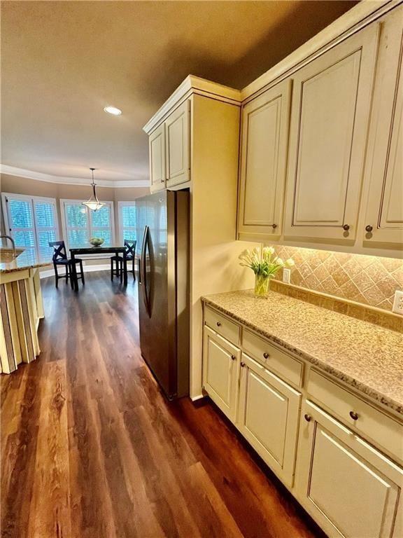 2502 Oak Hill Overlook Duluth, GA 30097 - Photo 17 of 34 a kitchen with granite countertop a refrigerator a sink and white cabinets