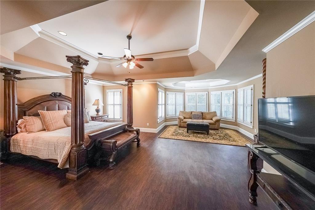2502 Oak Hill Overlook Duluth, GA 30097 - Photo 21 of 34 a living room with furniture and a flat screen tv