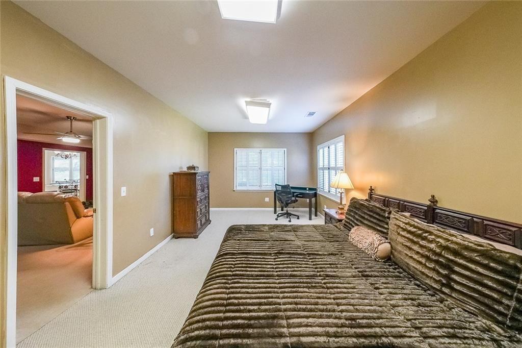 2502 Oak Hill Overlook Duluth, GA 30097 - Photo 29 of 34 a bed room with a bed and furniture