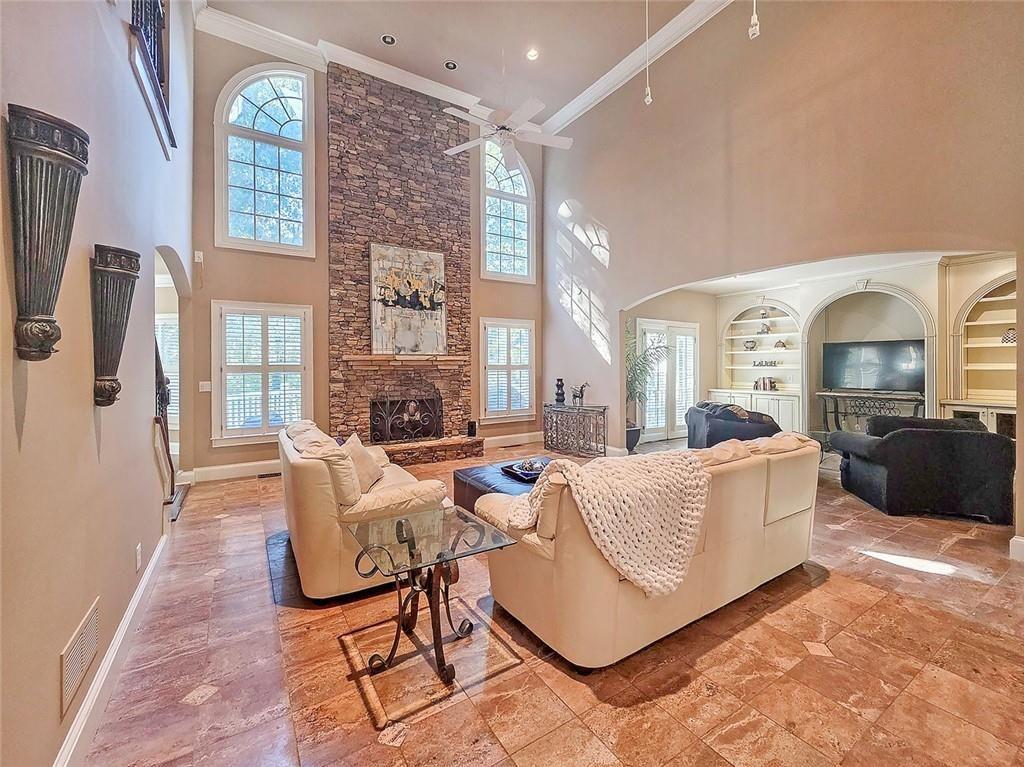 2502 Oak Hill Overlook Duluth, GA 30097 - Photo 4 of 34 a living room with furniture and a fireplace