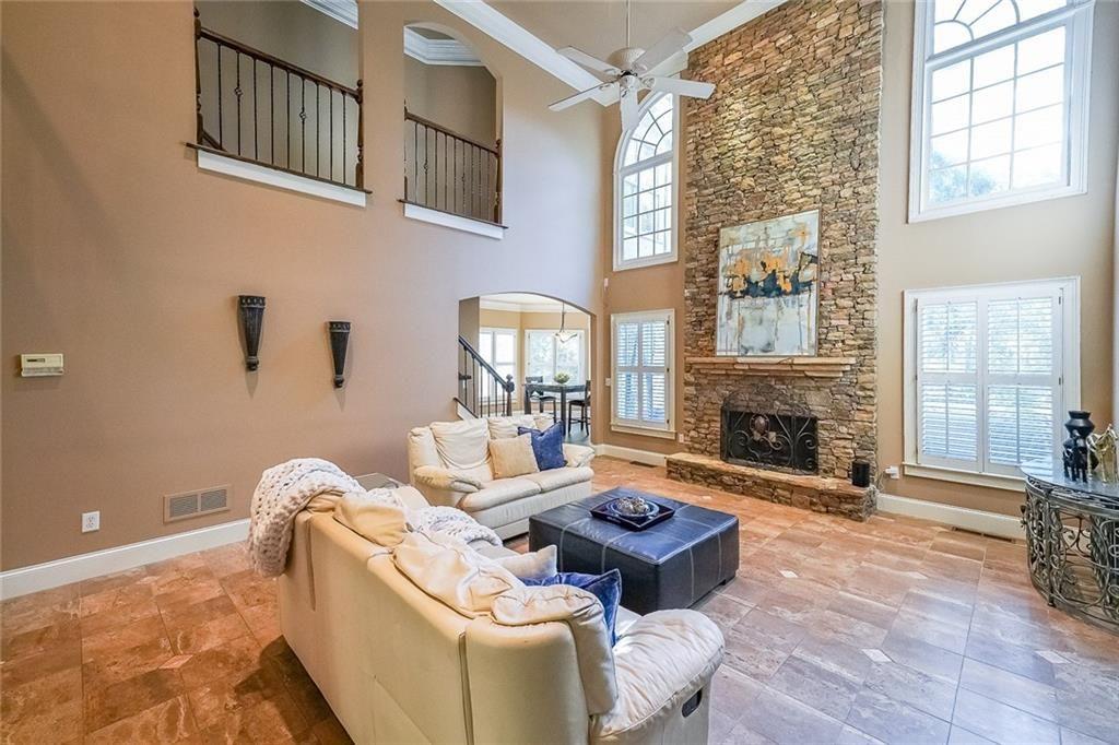 2502 Oak Hill Overlook Duluth, GA 30097 - Photo 6 of 34 a living room with furniture fireplace and a fireplace