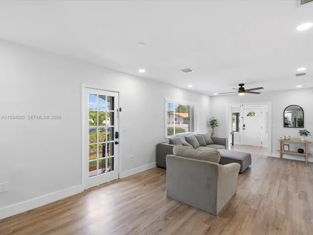 a living room with furniture and a window