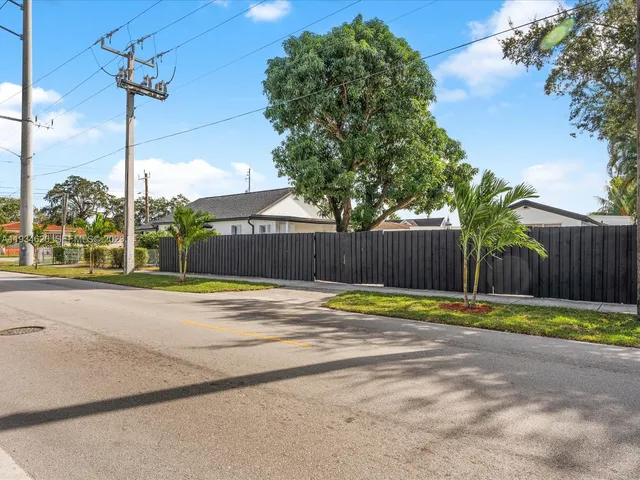a view of a swimming pool with a yard