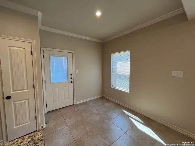 a view of an empty room and window