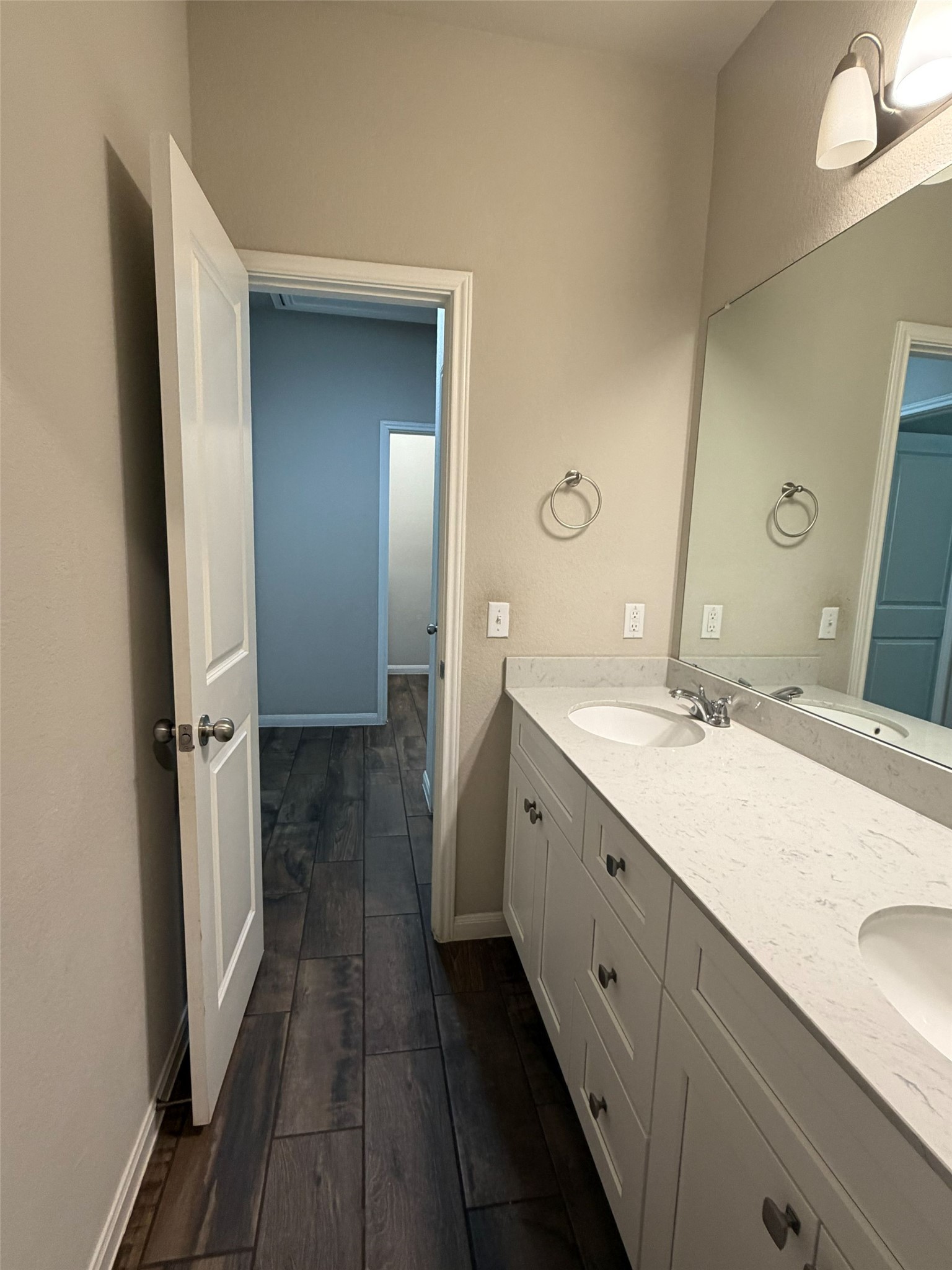 248 Falling Star Lane Georgetown, TX 78628 - Photo 10 of 16 Double vanities and modern tile flooring define this well-appointed bathroom.