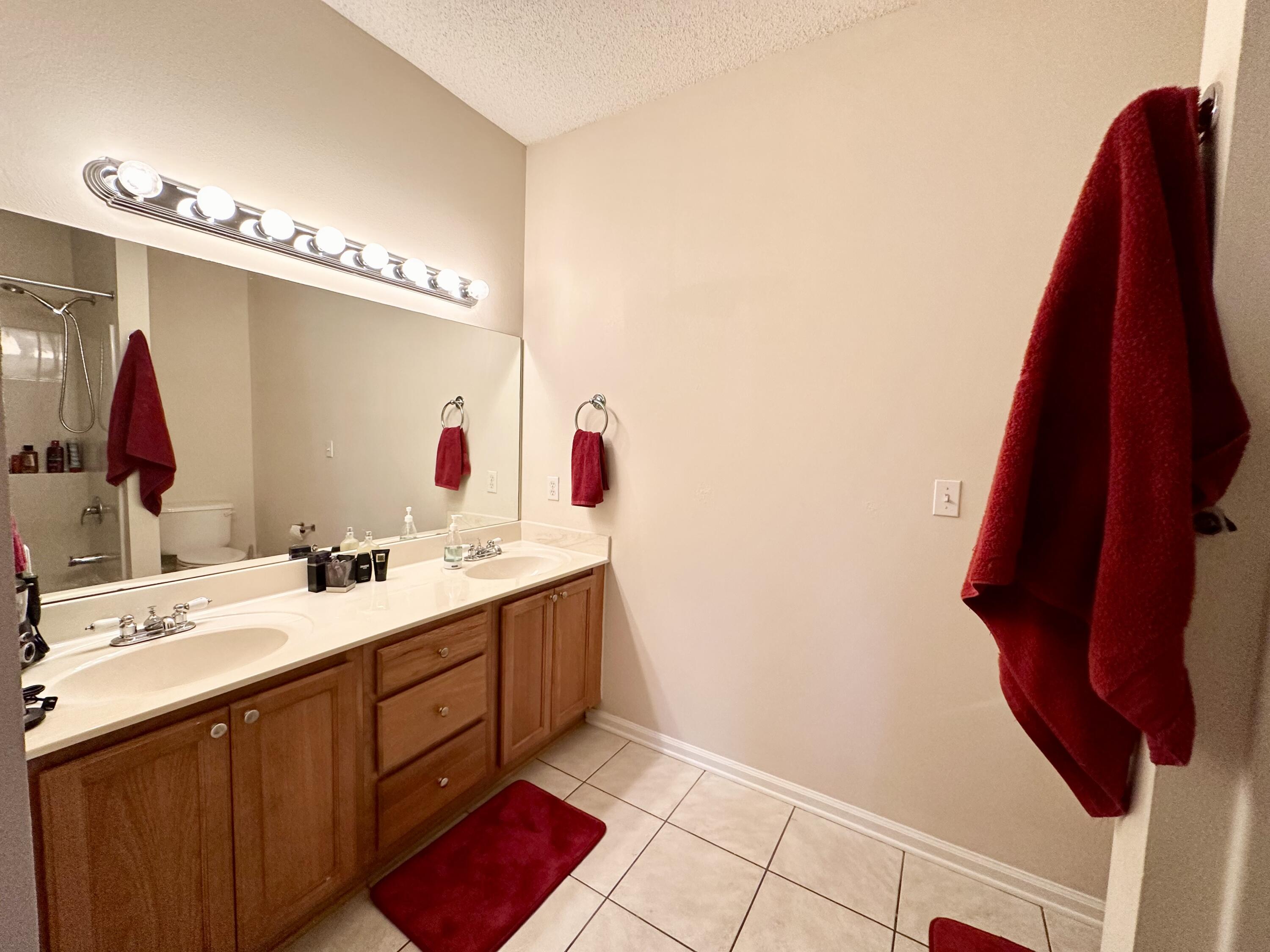 732 East Mack Bayou Drive, Unit 2 Santa Rosa Beach, FL 32459 - Photo 24 of 43 a bathroom with a sink vanity and a mirror
