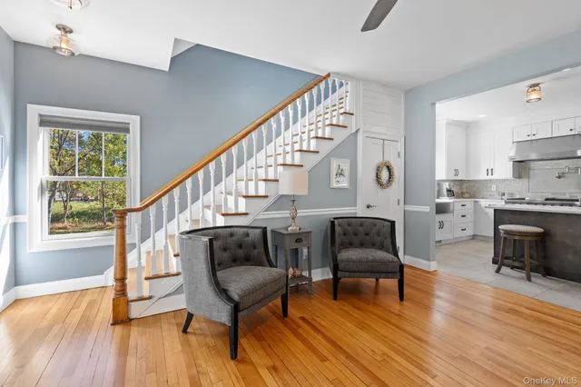 a living room with furniture fireplace and flat screen tv