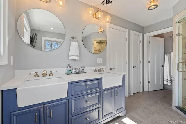 a spacious bathroom with a sink tub and a mirror