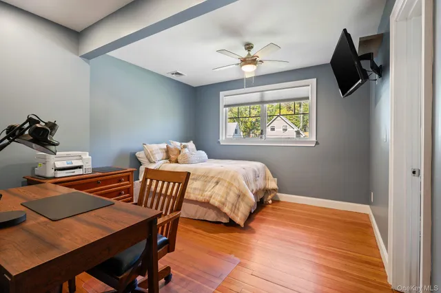 a spacious bathroom with a sink a mirror a vanity and a bathtub