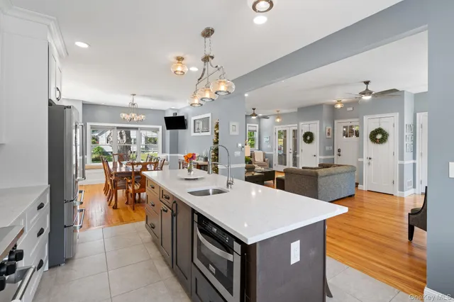 a view of a house with swimming pool next to a yard