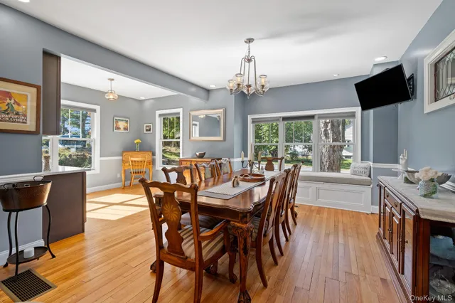 a large kitchen with a counter space a sink appliances and cabinets