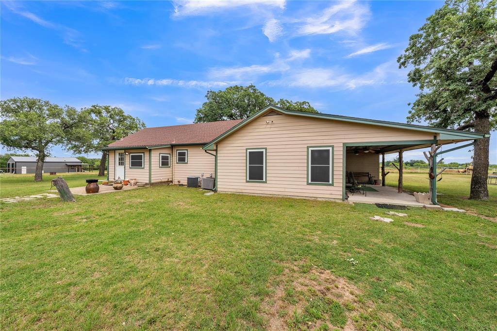 209 Dixie Road Millsap, TX 76066 - Photo 4 of 31 a view of a house with a backyard