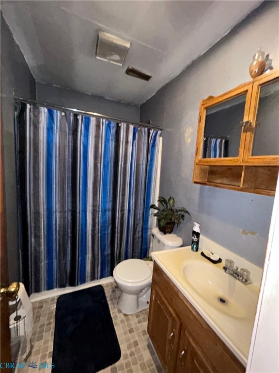 449 Gaskins Road Weems, VA 22576 - Photo 5 of 10 a bathroom with a sink toilet and shower