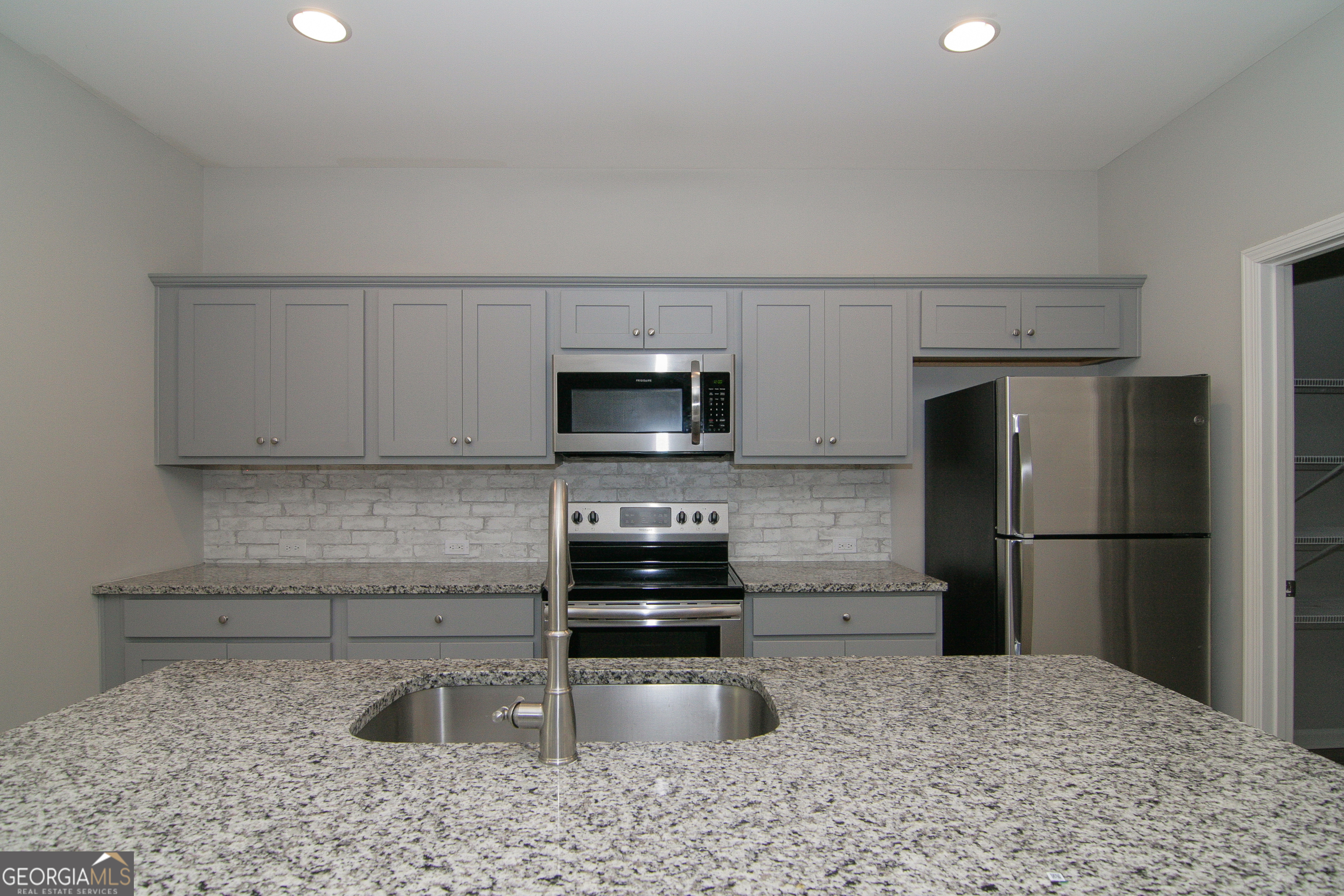 386 Springwater Way Bremen, GA 30110 - Photo 25 of 64 a kitchen with a refrigerator sink and stove