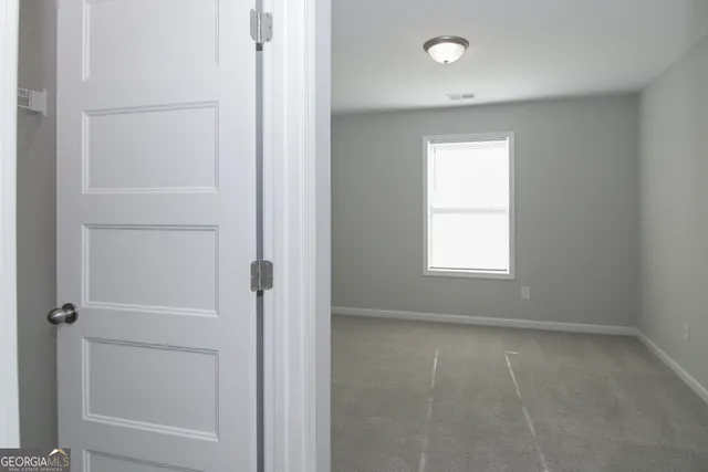 a bathroom with a granite countertop sink double and mirror
