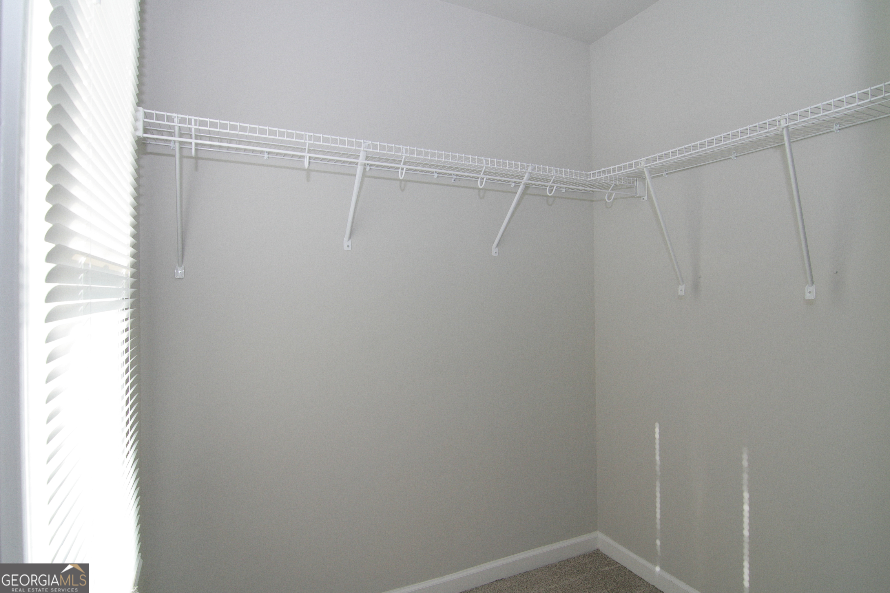 386 Springwater Way Bremen, GA 30110 - Photo 32 of 64 a view of a room with racks on the wall