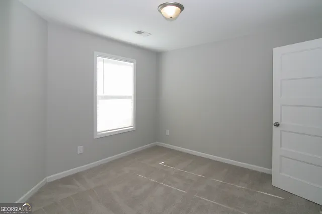 a bathroom with a bathtub and a toilet
