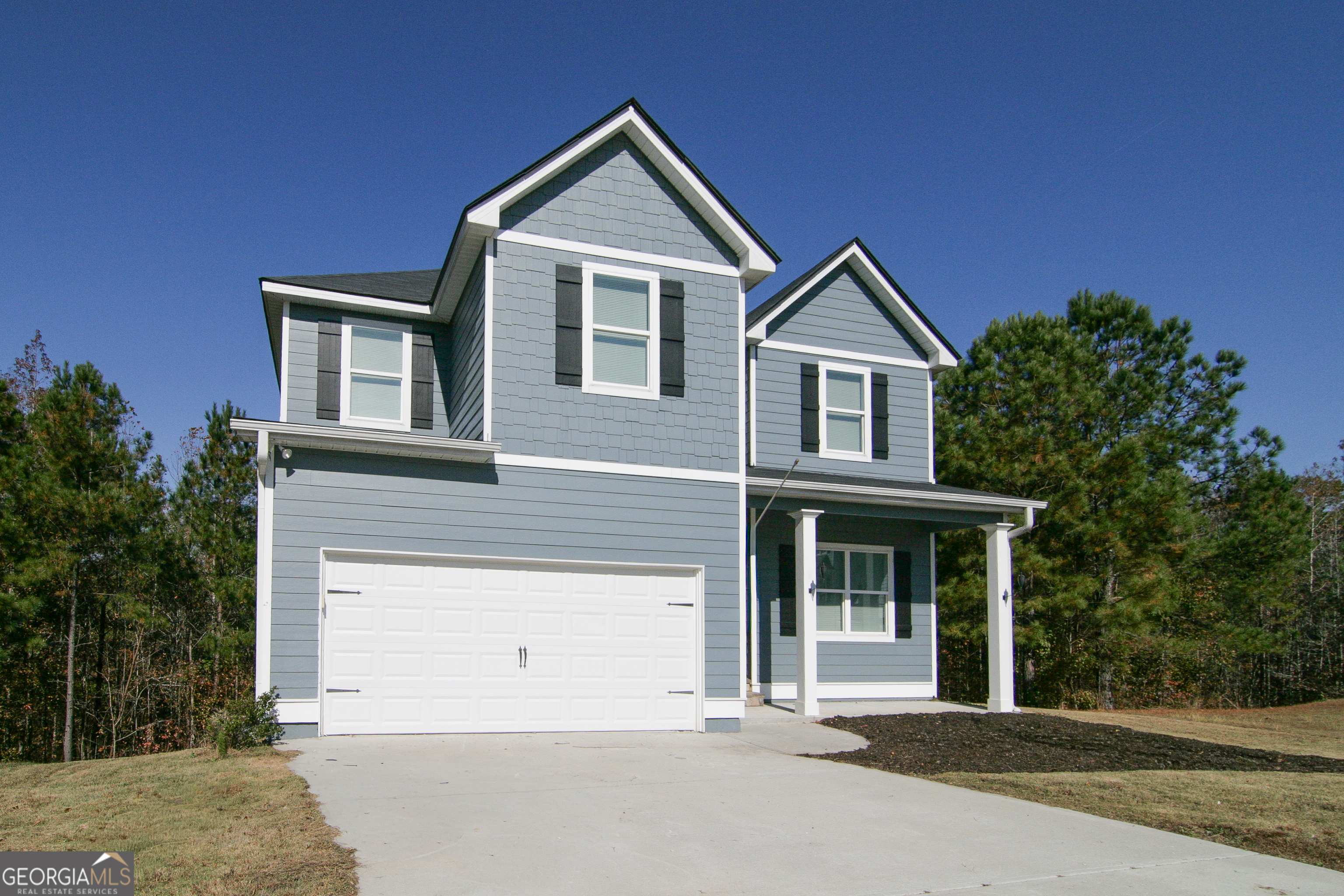 386 Springwater Way Bremen, GA 30110 - Photo 59 of 64 a front view of a house with a yard and garage