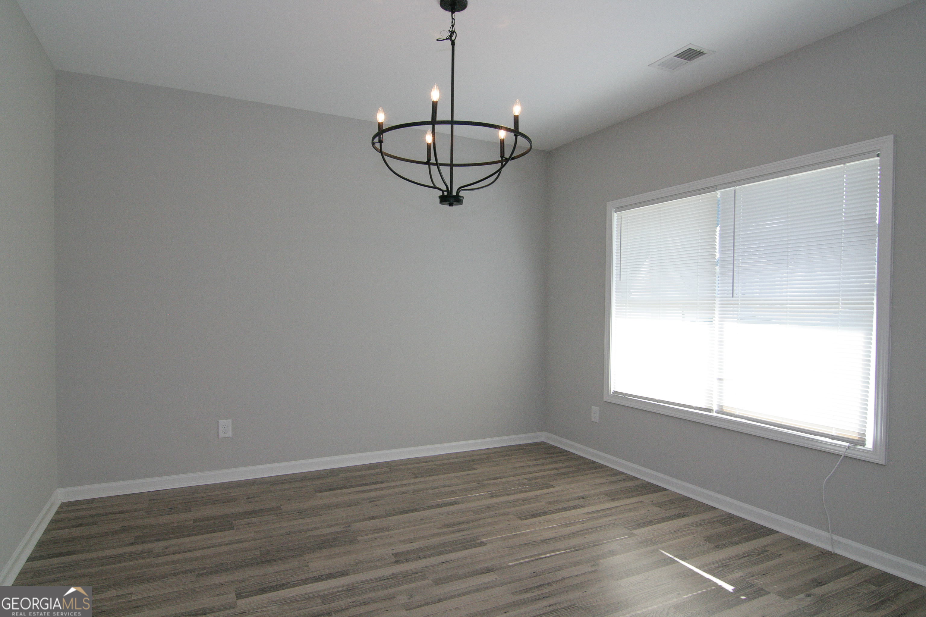 386 Springwater Way Bremen, GA 30110 - Photo 7 of 64 a view of a room with wooden floor and window