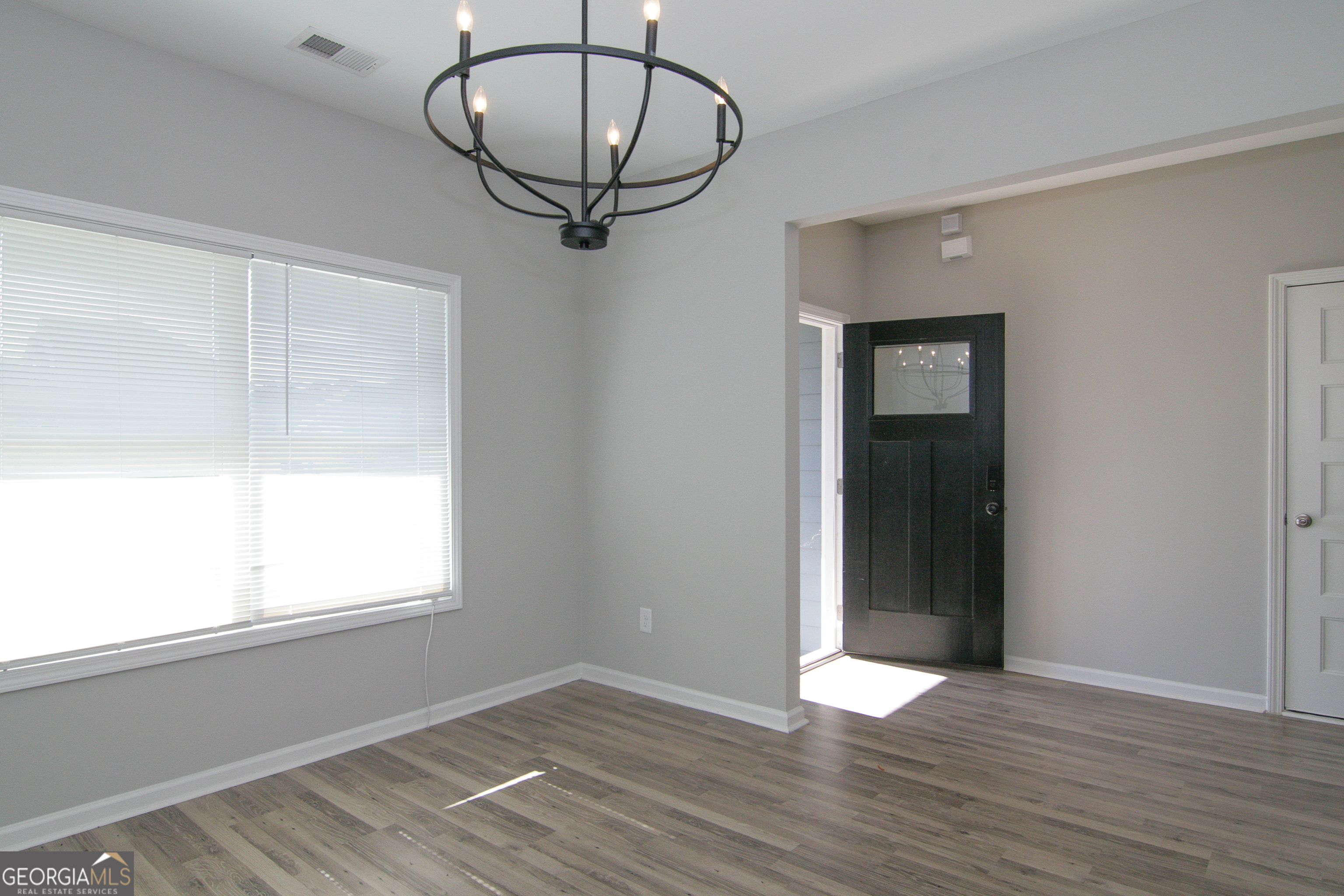 386 Springwater Way Bremen, GA 30110 - Photo 8 of 64 wooden floor in an empty room with a window