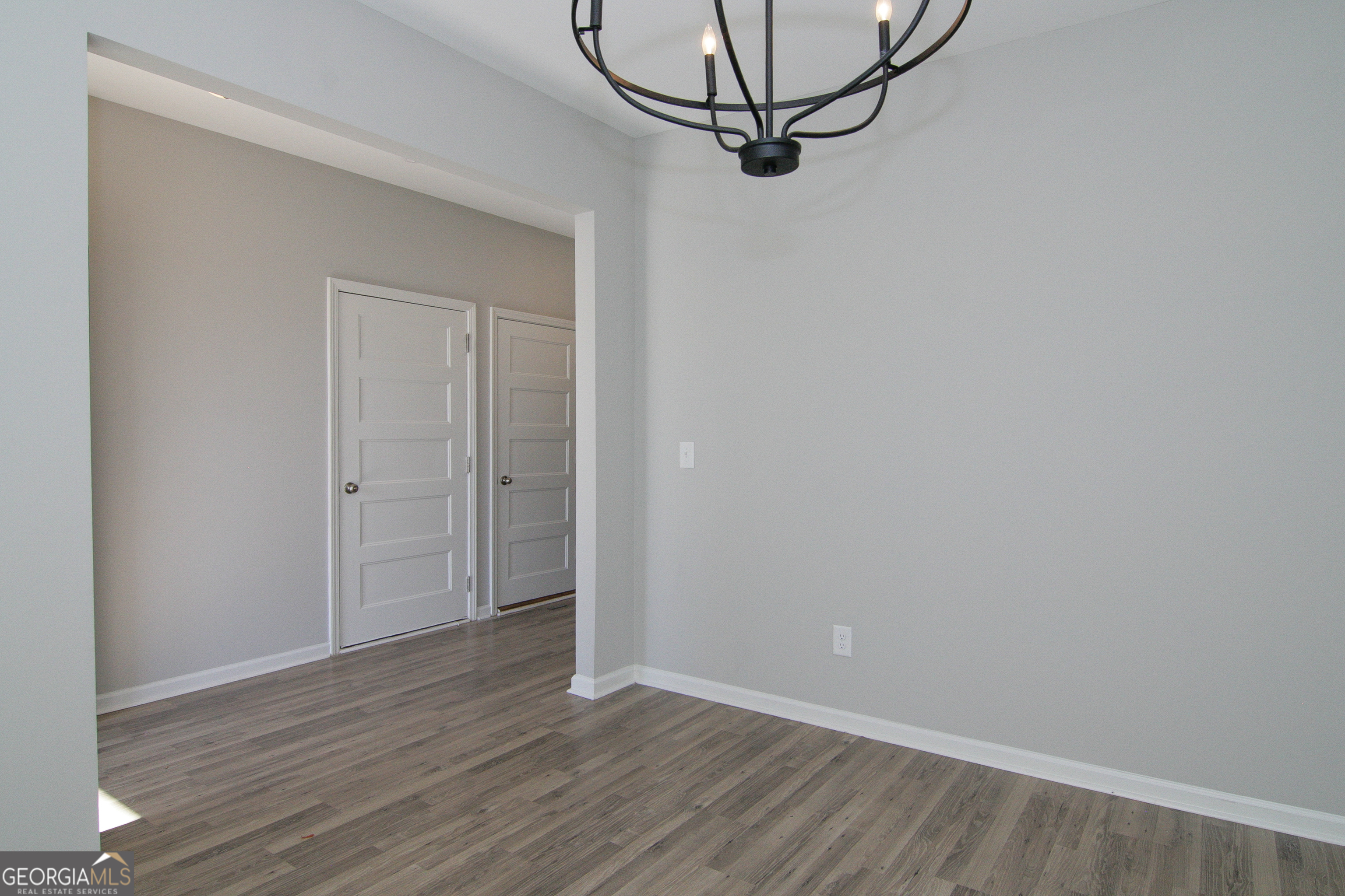 386 Springwater Way Bremen, GA 30110 - Photo 9 of 64 a view of a room with wooden floor and white walls