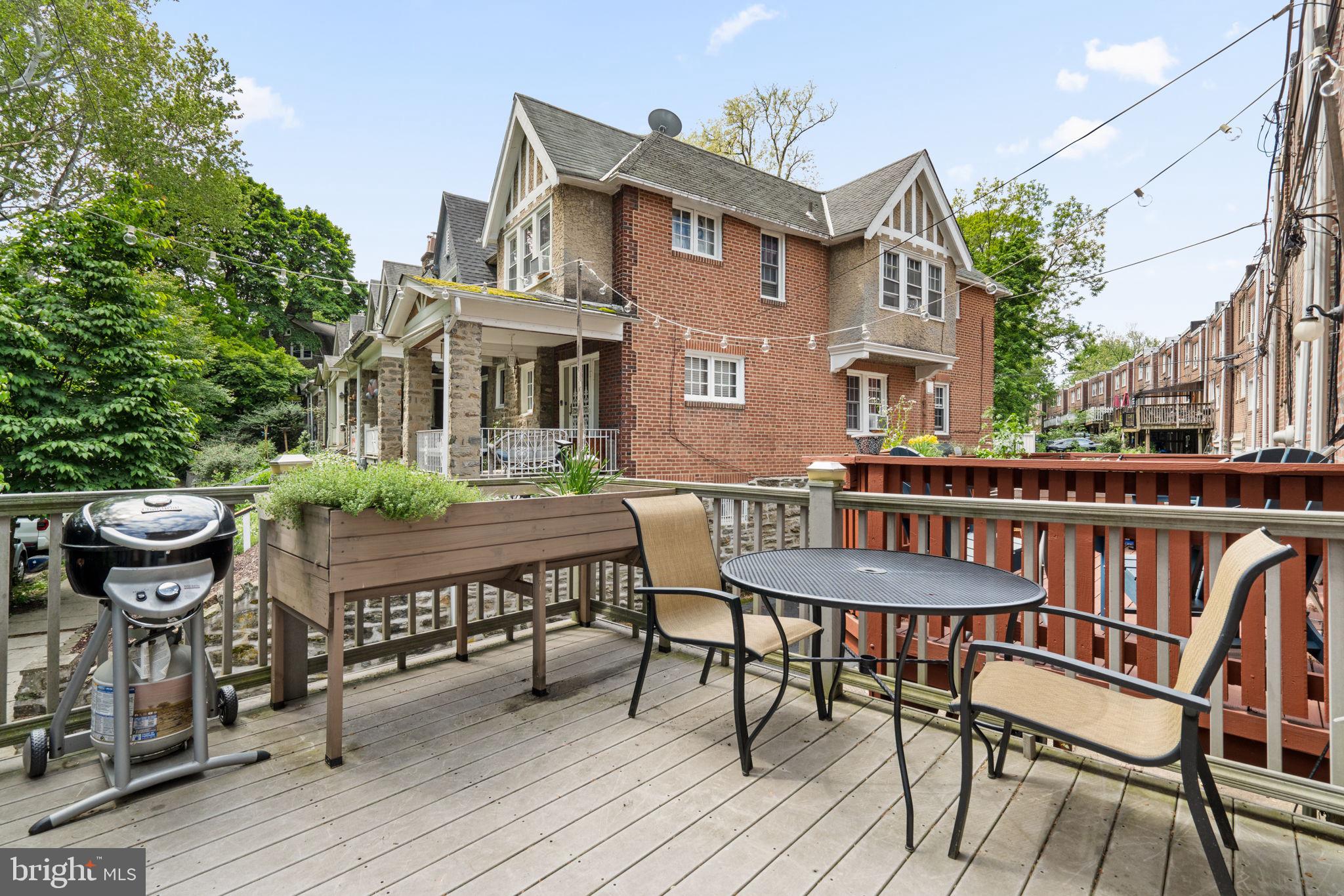 156 Roumfort Road Philadelphia, PA 19119 - Photo 29 of 56 a view of a patio with table and chairs and potted plants