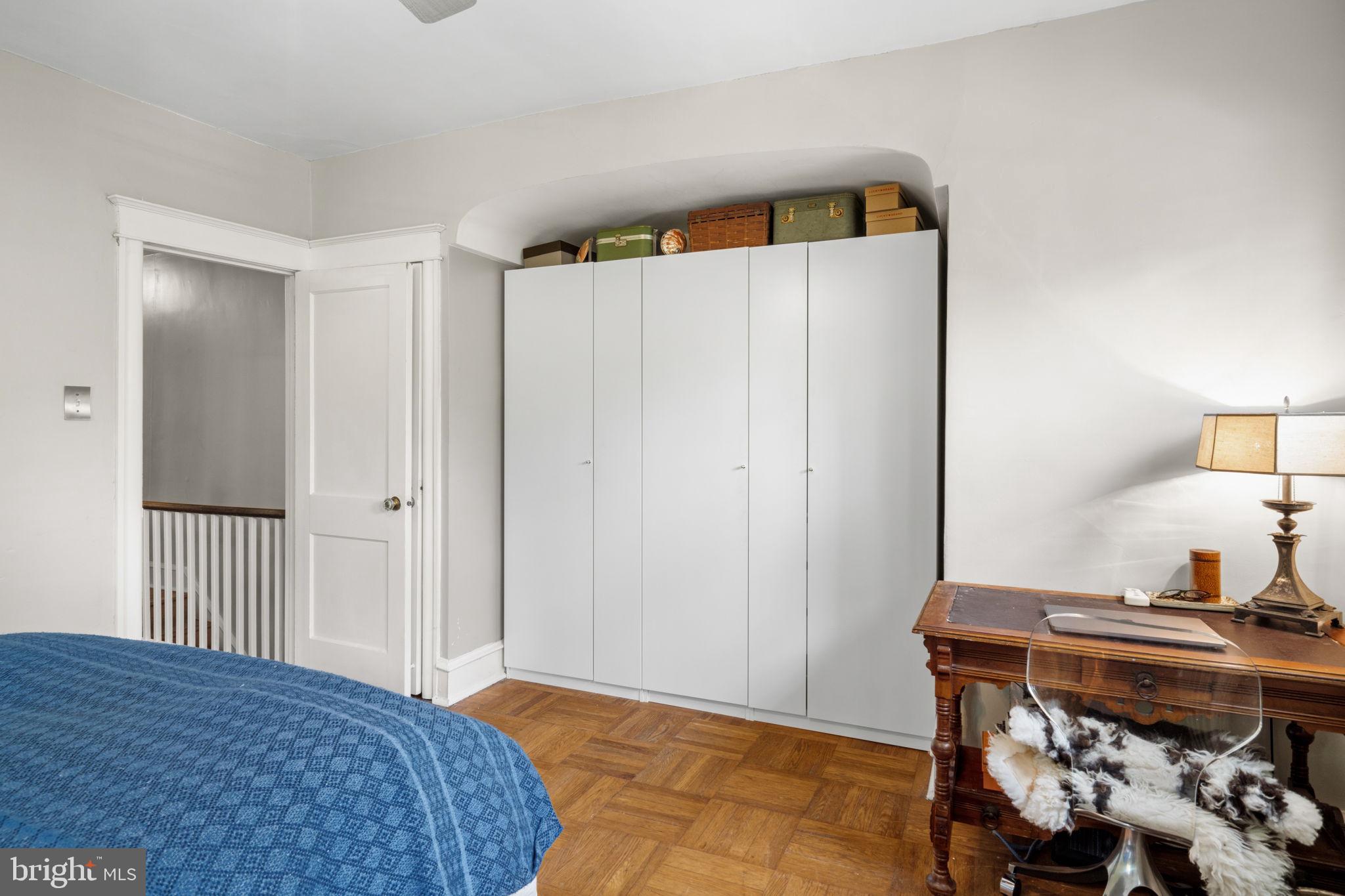 156 Roumfort Road Philadelphia, PA 19119 - Photo 35 of 56 a bedroom with a bed and a table in it