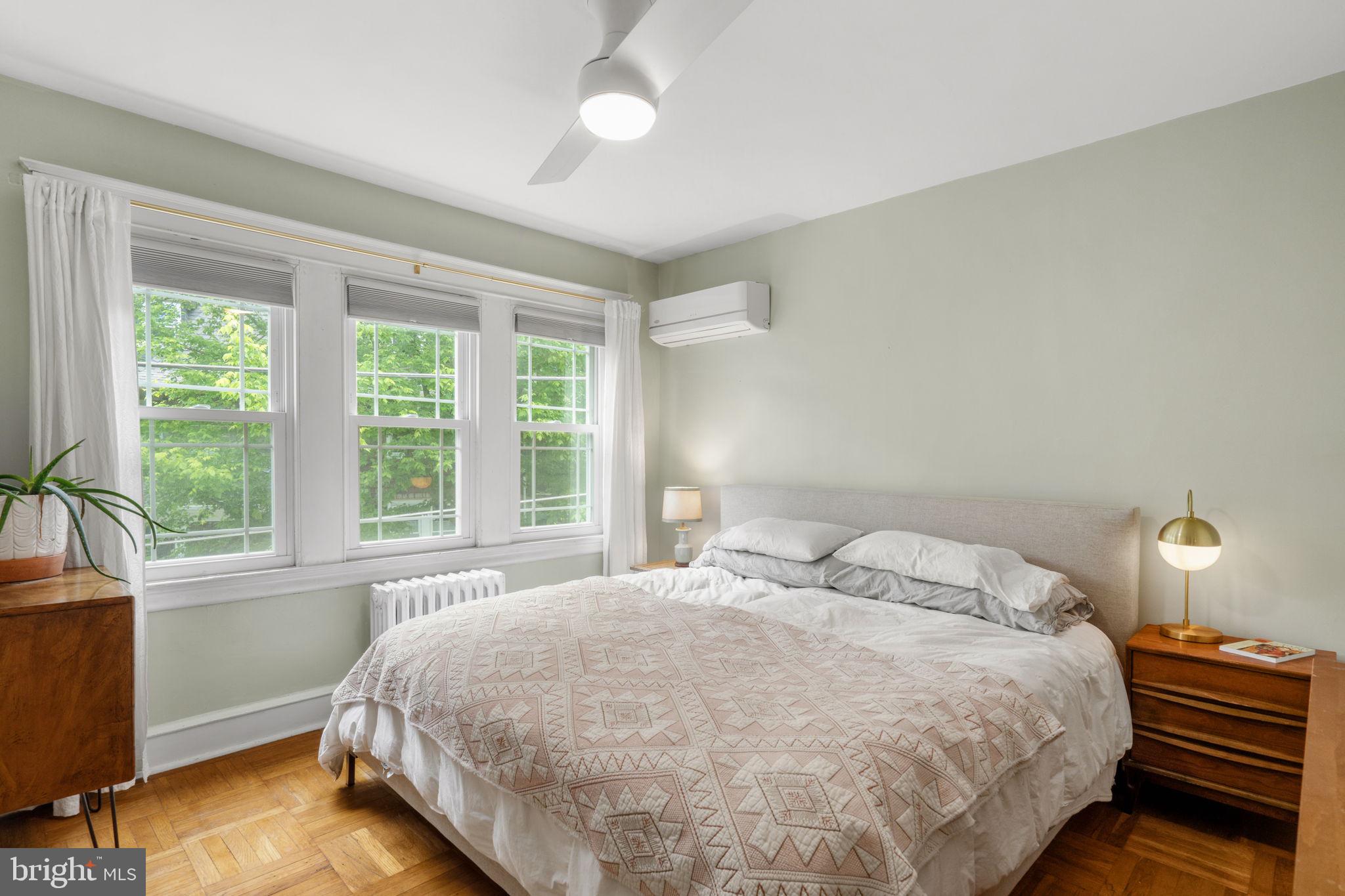 156 Roumfort Road Philadelphia, PA 19119 - Photo 41 of 56 a large bed sitting in a bedroom next to a window