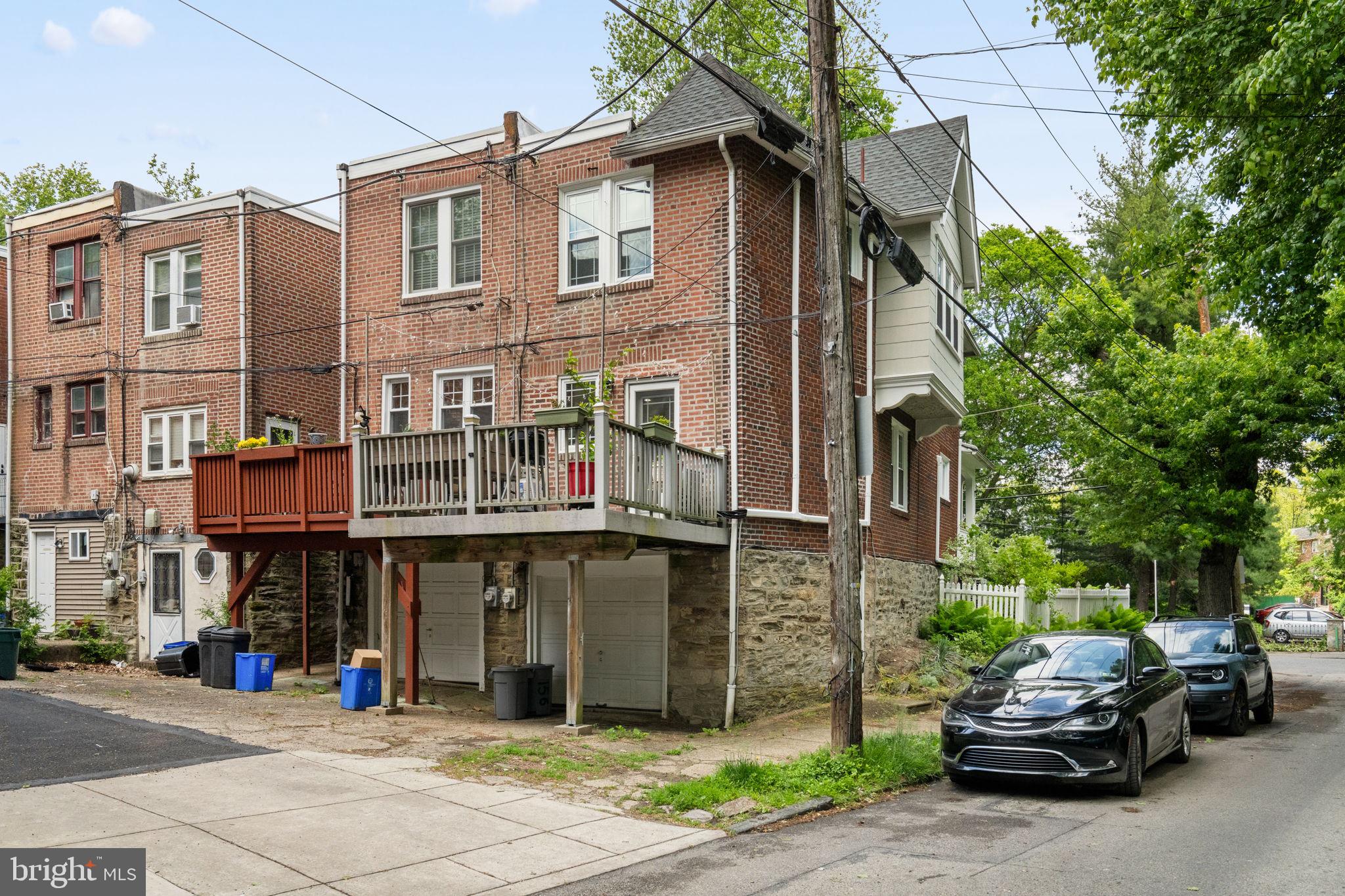 156 Roumfort Road Philadelphia, PA 19119 - Photo 55 of 56 a car parked in front of a building