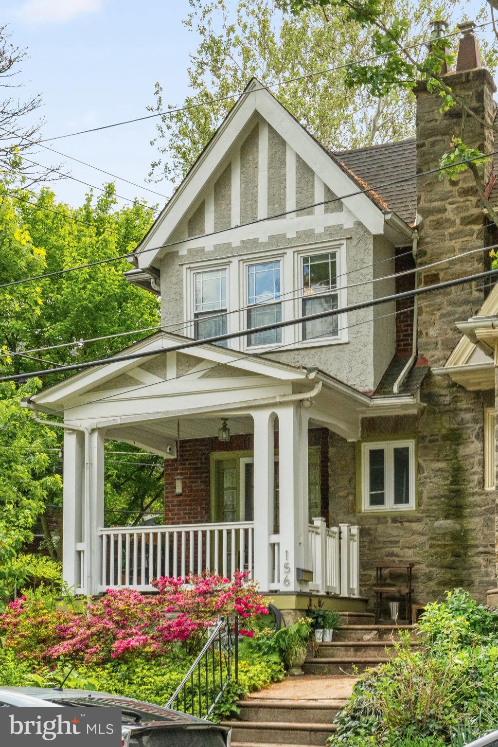 156 Roumfort Road Philadelphia, PA 19119 - Photo 7 of 56 a front view of a house with a garden