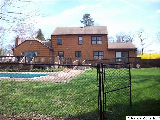 17 Laird Road Colts Neck, NJ 07722 - Photo 1 of 3 a front view of a house with garden