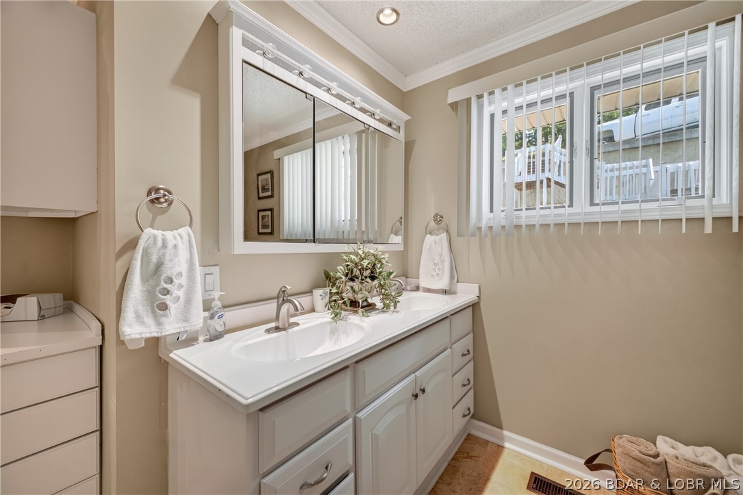 47 County Rd W-22S Lake Ozark, MO 65049 - Photo 46 of 68 White on white double vanity is timeless