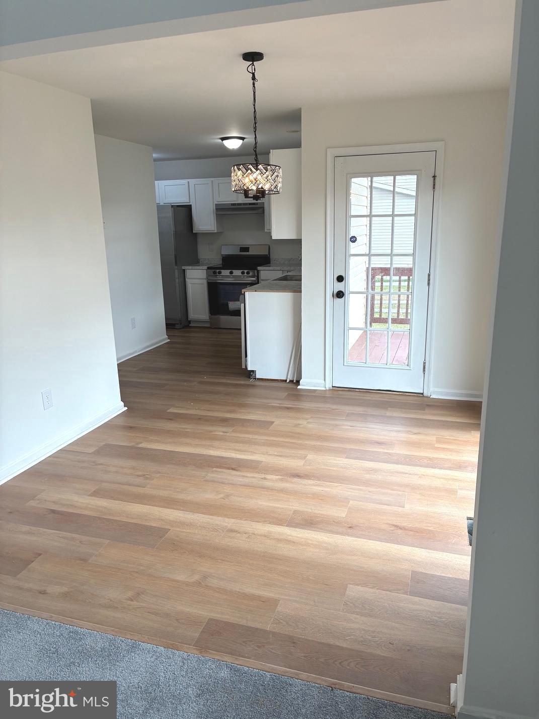 331 North Teal Road Martinsburg, WV 25405 - Photo 11 of 35 a view of a kitchen with a sink wooden floor and chandelier