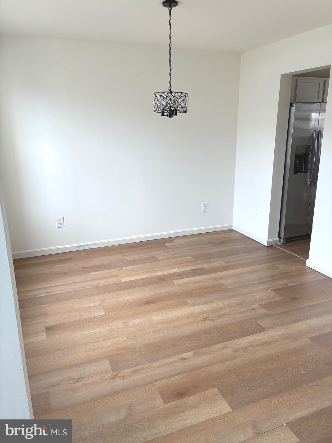 331 North Teal Road Martinsburg, WV 25405 - Photo 14 of 35 a view of a room with wooden floor and kitchen view
