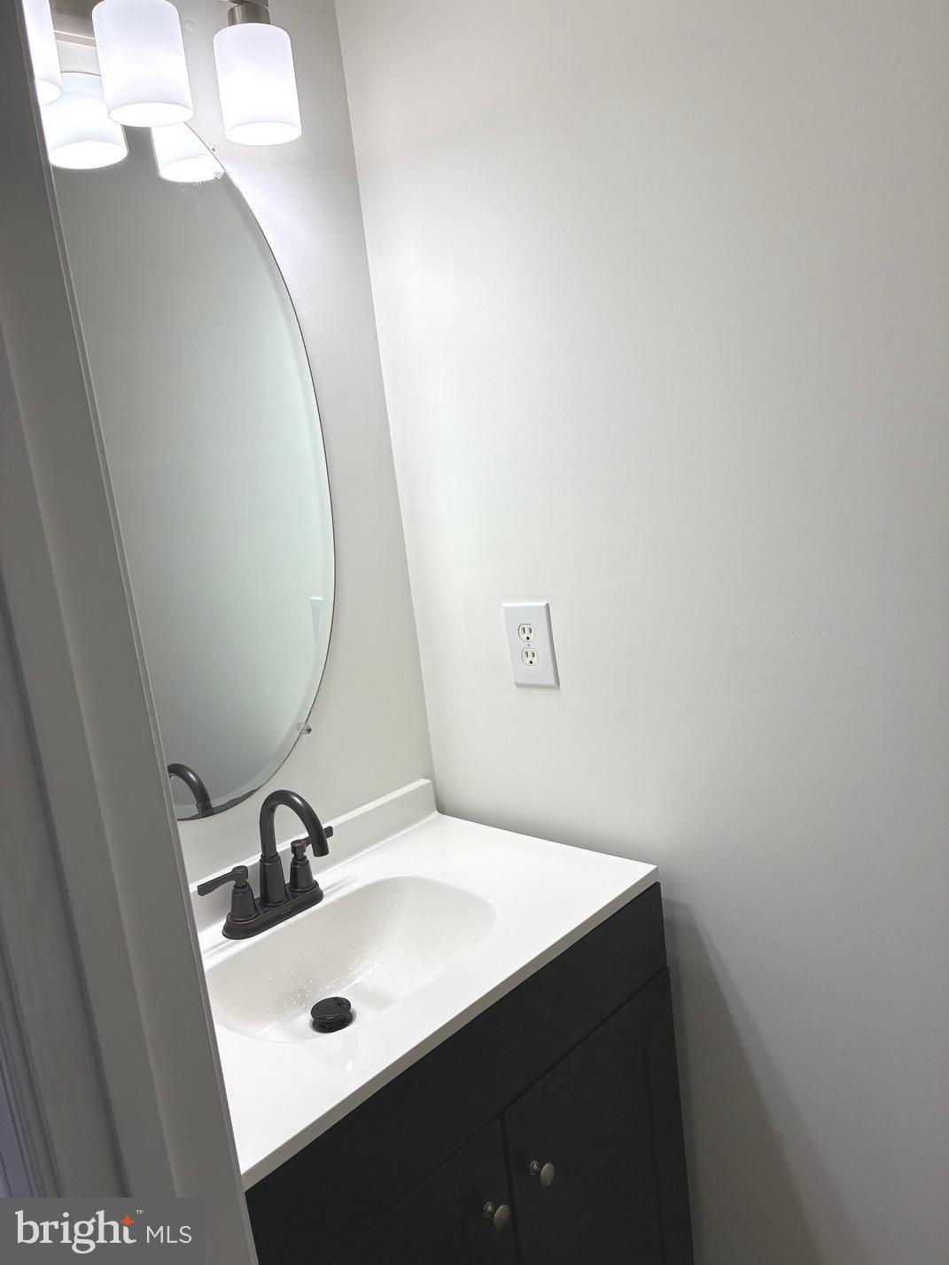 331 North Teal Road Martinsburg, WV 25405 - Photo 17 of 35 a bathroom with a sink and mirror