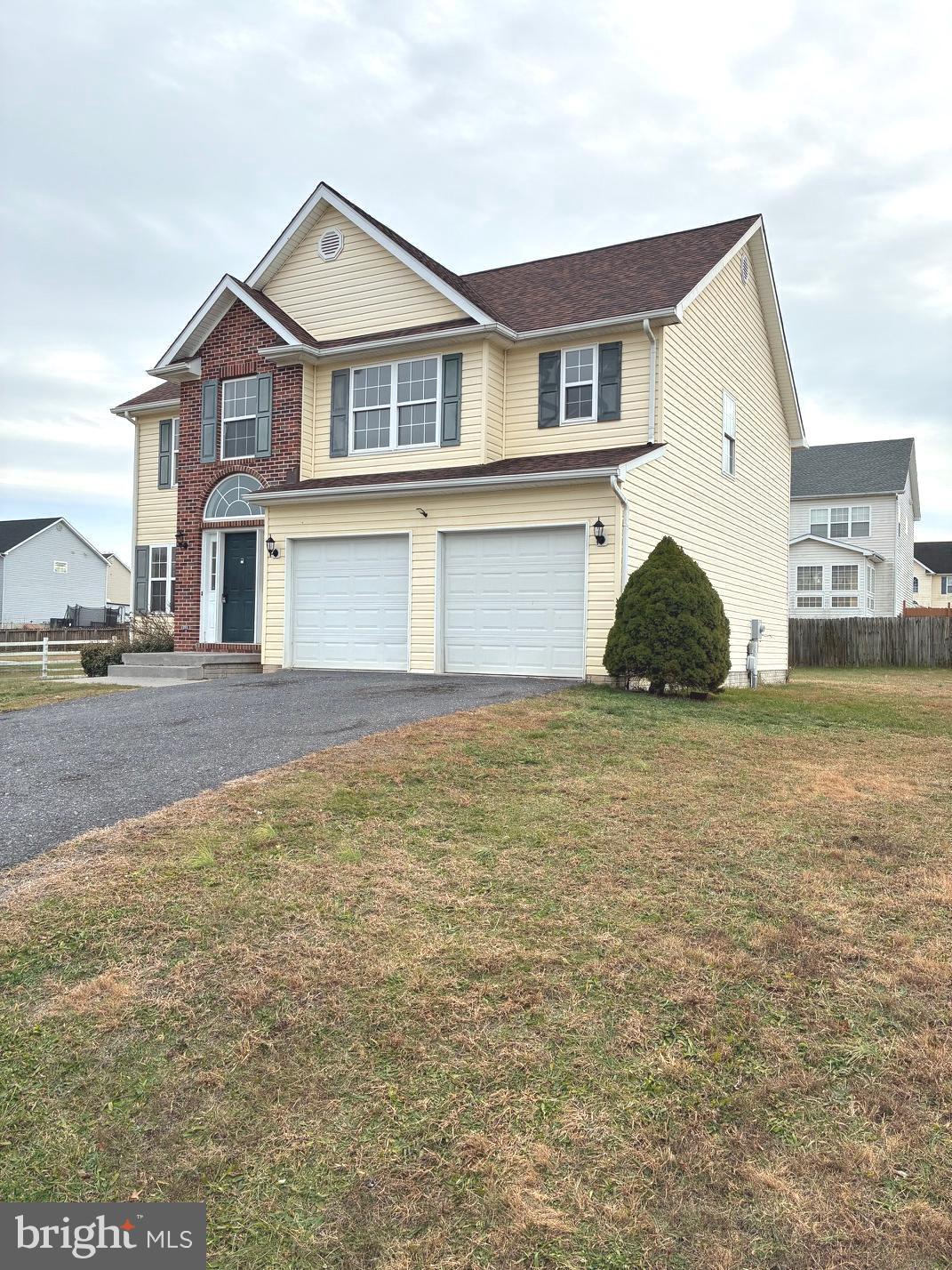 331 North Teal Road Martinsburg, WV 25405 - Photo 2 of 35 a front view of a house with a garden