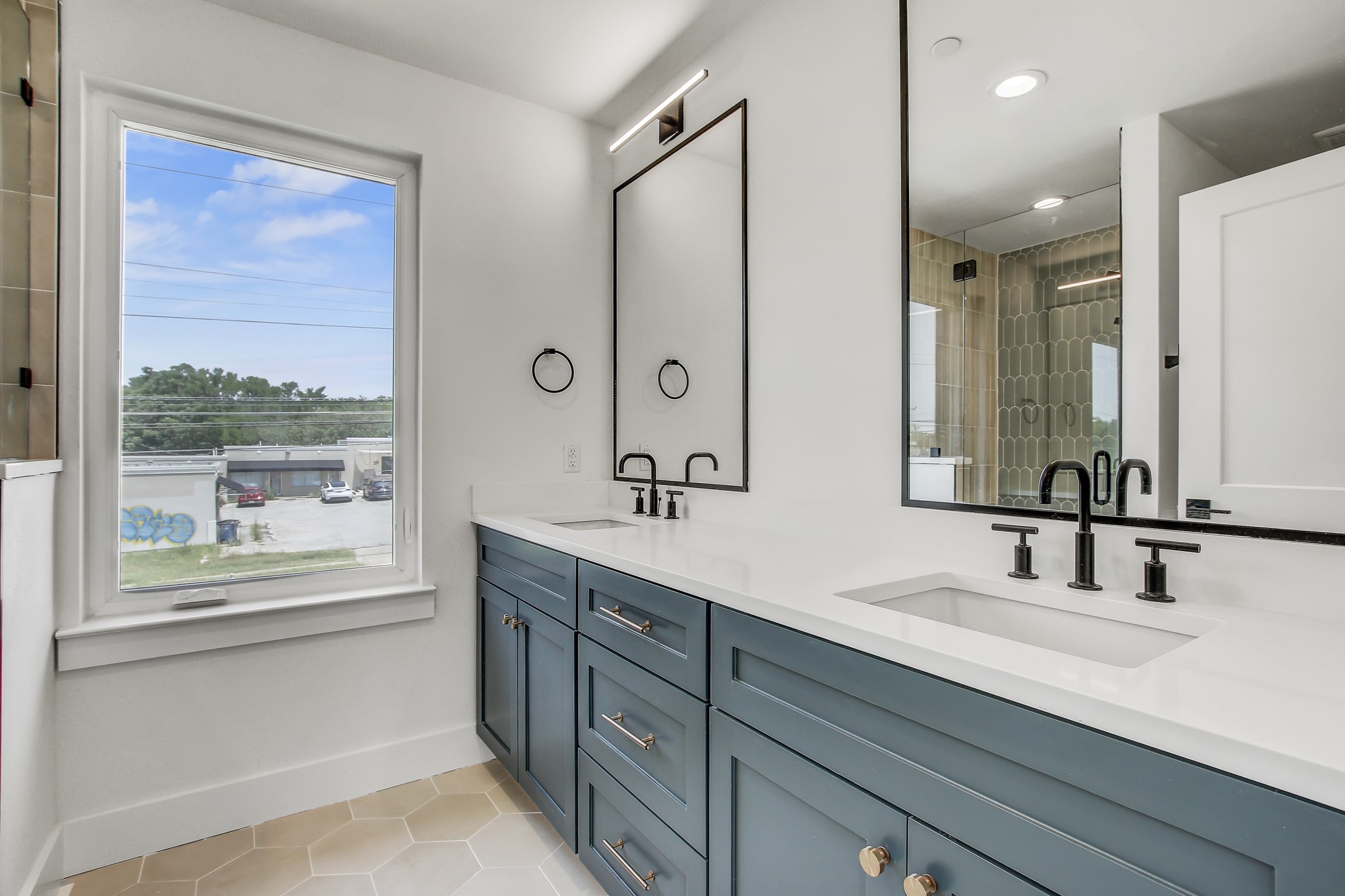 4127 East 12th Street, Unit 5 Austin, TX 78721 - Photo 6 of 33 Bathroom with tile patterned flooring, baseboards, double vanity, recessed lighting, and a tile shower
