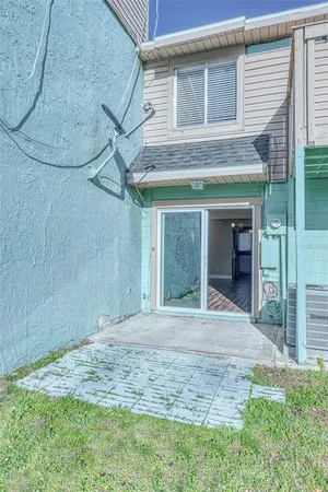 a view of a house with a backyard